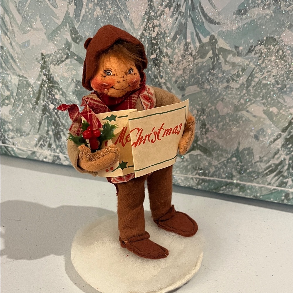 This is an Annalee 5" Old World Caroler Boy doll,